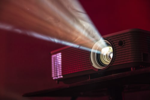 A screen projector displaying a customer presentation